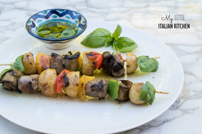 Sausage, new potato, vegetables BBQ skewers with basil infused olive oil